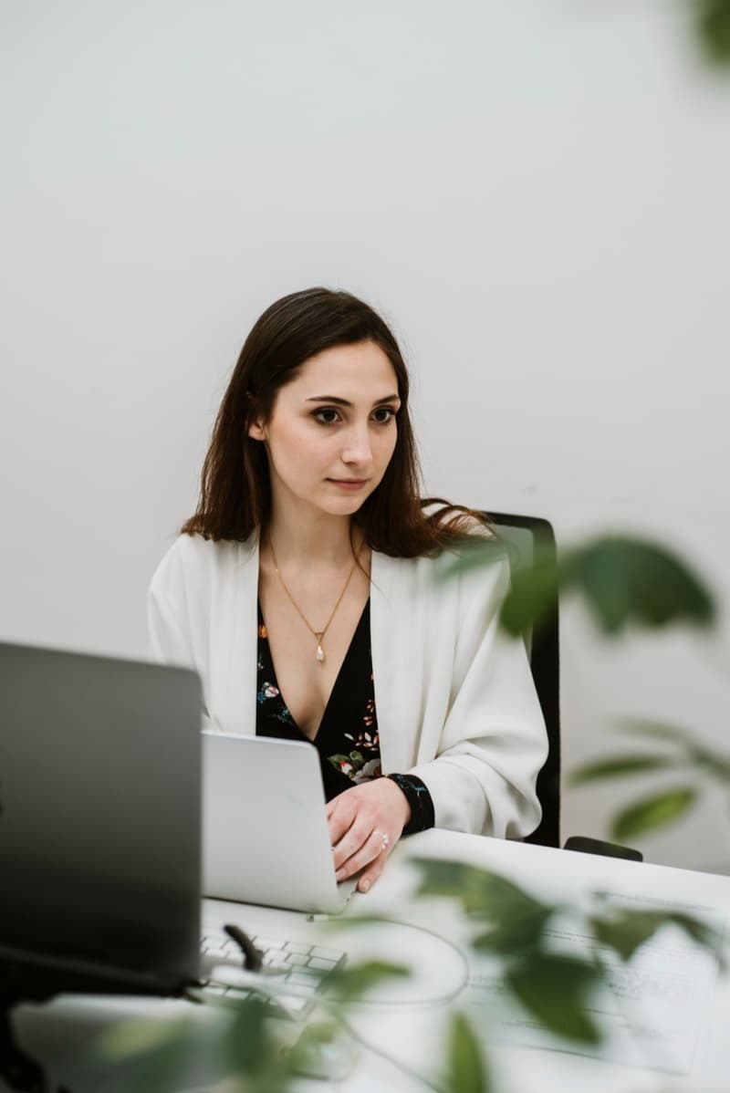 Krakspire immigration consultant working on employer cases at the office